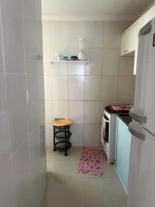 a small kitchen with a table and a stove at Gilvan Rocha in Aracaju