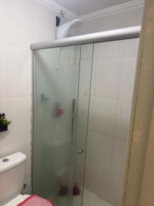 a glass shower in a bathroom with a toilet at Gilvan Rocha in Aracaju +2 photos