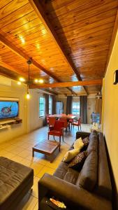 a living room with a couch and a table at Alojamiento Napoleon in Puerto Iguazú