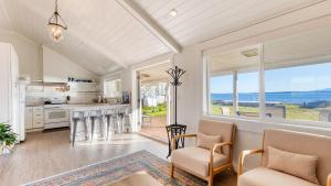 an open kitchen with a view of the ocean at Cozy Whidbey Island Stay Steps to the beach Fireplace BBQ Near Trails in Freeland