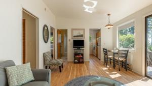 a living room with a couch and a table at Mutiny Bay Waterfront Cabin by AvantStay Views in Freeland