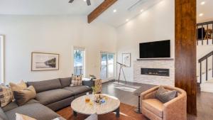a living room with a couch and a fireplace at Explorer by AvantStay Close to Slopes Game Room Guest Suite Hot Tub in Alpine Meadows