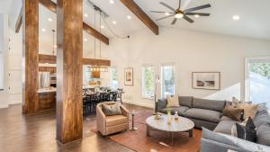 a living room with a couch and a table at Explorer by AvantStay Close to Slopes Game Room Guest Suite Hot Tub in Alpine Meadows