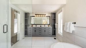 a bathroom with a sink and a mirror at Explorer by AvantStay Close to Slopes Game Room Guest Suite Hot Tub in Alpine Meadows +39 photos