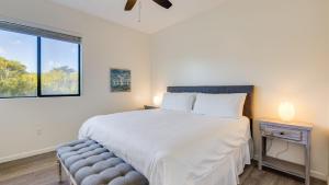 a bedroom with a large white bed and a window at Beachfront 2BR w Deck Views Direct Sand Access Strand Way A in Oceano