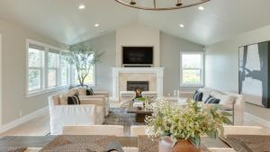 a living room with white furniture and a fireplace at Chic Sonoma Oasis w Pool Bocce Hot Tub Minutes to Downtown in Sonoma