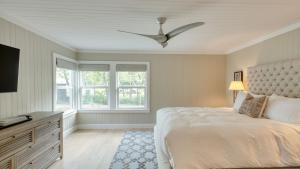 a bedroom with a bed and a ceiling fan at Chic Sonoma Oasis w Pool Bocce Hot Tub Minutes to Downtown in Sonoma +38 photos