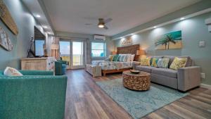 a living room with a couch and a table at Beachfront Condo Prvt Balcony w View Pool Access Beach Happy by AvantStay in Port Aransas