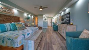 a large living room with a couch and a tv at Beachfront Condo Prvt Balcony w View Pool Access Beach Happy by AvantStay in Port Aransas +41 photos