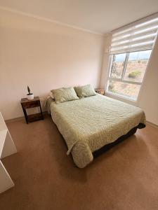 Una cama o camas en una habitación de Departamento Arriendo Diario