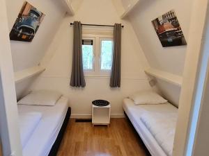 Ένα ή περισσότερα κρεβάτια σε δωμάτιο στο Cozy Ardennes Chalet near Durbuy