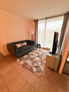 Una televisión o centro de entretenimiento en Departamento Arriendo Diario