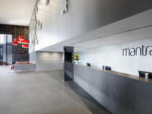 a lobby with a martini sign on the wall at Mantra Circle On Cavill in Gold Coast +69 photos