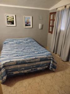 Ένα ή περισσότερα κρεβάτια σε δωμάτιο στο Casa Los Abuelos