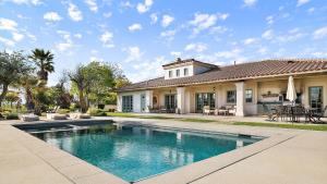 a house with a swimming pool in front of a house at Wellsona Vineyard Retreat Pool Hot Tub Views Main Home Guest Home in Paso Robles