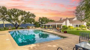 a swimming pool in the backyard of a house at Sonoma Sunshine by AvantStay Countryside Views in Glen Ellen