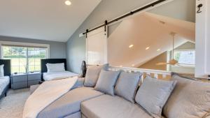 a living room with a couch and a window at Sunny Backyard Fireplace Coastal Access in Peaceful Neighborhood Near Shopping in Langley