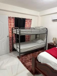 Postel nebo postele na pokoji v ubytování R&N tropical