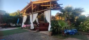 Сад в Casa hermosa en la playa +13 фотографий