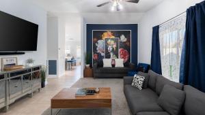 a living room with a couch and a tv at Pacifica Sur by AvantStay Pool Hot Tub Gazebo in Indio