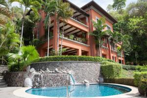 a building with a swimming pool in front of a building at Montebello 2C - 3 bdr 3 bath Ocean View in La Mona