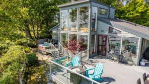 an exterior view of a tiny house with two chairs at Saratoga Vista by AvantStay Waterfront Views in Langley