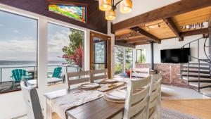 a dining room with a table and chairs and a window at Saratoga Vista by AvantStay Waterfront Views in Langley