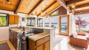 a kitchen with a view of the ocean at Saratoga Vista by AvantStay Waterfront Views in Langley