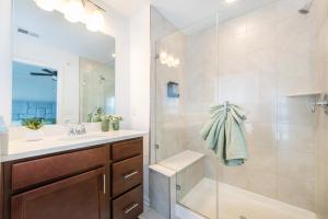 a bathroom with a shower and a sink and a mirror at Glam Family Funhouse NYC Access Adventure in Fair Lawn +29 photos