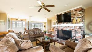 a living room with couches and a fireplace at Olive Ranch by AvantStay Enjoy Sunsets over the Valley 4.5 Acre Ranch Home in Paso Robles