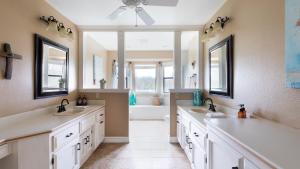 a bathroom with two sinks and a bath tub at Olive Ranch by AvantStay Enjoy Sunsets over the Valley 4.5 Acre Ranch Home in Paso Robles +52 photos