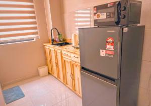 Kuchyň nebo kuchyňský kout v ubytování NonaHome Nilai 3