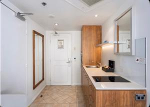 a kitchen with a sink and a counter top at Stunning Oceanview - Beachfront hotel suite in Gold Coast
