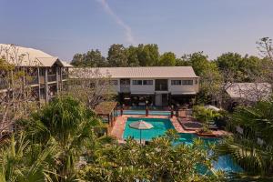 an aerial view of a resort with a swimming pool at Pinctada Hotel Broome in Broome