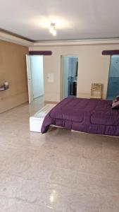 Postel nebo postele na pokoji v ubytování Quincho Vayolet + 13 fotografií