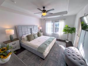 a bedroom with a bed and a ceiling fan at Glam Family Funhouse NYC Access Adventure in Fair Lawn