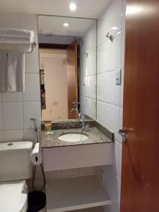 Ένα μπάνιο στο Suítes Executivas