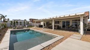a swimming pool in the backyard of a house at Montego by AvantStay Private Yard w Pool Hot Tub in Indio