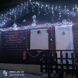 a house decorated with christmas lights and a door at Cottage in Ciudad Quesada in Ciudad Quesada