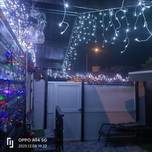 a house with christmas lights on the roof at Cottage in Ciudad Quesada in Ciudad Quesada