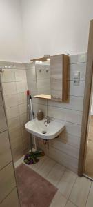 a bathroom with a sink and a mirror at unit_type_semidetached_house Siofok 54624 in Balatonszabadi Fürdőtelep