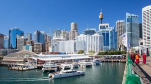 a group of boats docked at a marina in a city at ICC & Darling Harbour Stylish 3BR House with Parking in Sydney