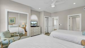 Кровать или кровати в номере 131 Grand Pavilion by AvantStay Oceanfront On The Boardwalk