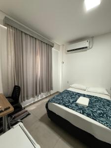 Ένα ή περισσότερα κρεβάτια σε δωμάτιο στο Flat Central