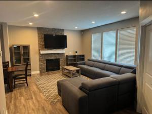 a living room with a couch and a fireplace at Home in Vancouver in Vancouver
