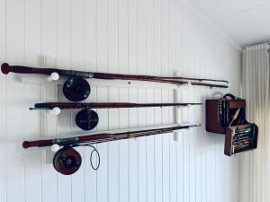 a room with three shelves with pots and pans at Barbara's Beach House in Hallidays Point +4 photos