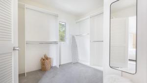 a bathroom with a mirror and a walk in shower at Stardust by AvantStay Views Hot Tub Pool Table in Malibu +63 photos