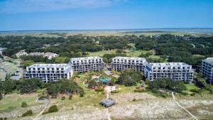 an aerial view of buildings on top of a hill at 123D Shipwatch by AvantStay Beach Access Pool in Isle of Palms