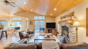 a living room with a couch and a fireplace at Washoe Chalet by AvantStay Game Room Hot Tub Putting Green Fire Pit in Tahoma