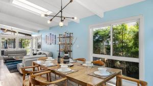 a dining room with a table and chairs at Stone Lagoon by AvantStay Steps to the Beach Backyard Oasis in San Clemente